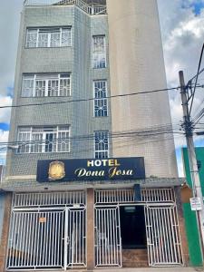 a large building with a hotel double tower at HOTEL DONA JOSA in Carmo do Cajuru