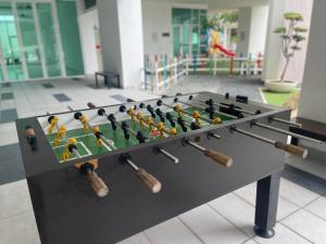 a foosball table with chess pieces on it at Ipoh D Festivo Suites 6-10pax 10mins to Sunway Tambun by IWH in Ipoh