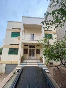 an empty street in front of a building at Villa familys in Fez