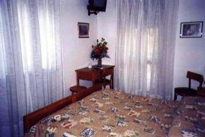 Postel nebo postele na pokoji v ubytování Hotel Savoia Debili