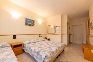 Postel nebo postele na pokoji v ubytování Hotel degli Ulivi