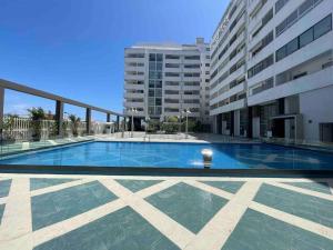 a large swimming pool in the middle of a building at Royale duplexe Pleine Centre Tanger in Tangier