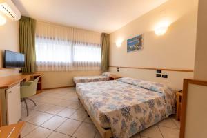 Postel nebo postele na pokoji v ubytování Hotel degli Ulivi