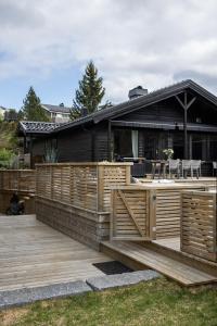 a wooden deck in front of a house at Villa Marikollen in Hektner
