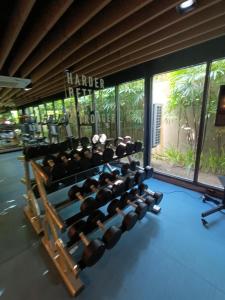 a gym with a large rack of dumbbells at The Marvest Hua Hin in Hua Hin