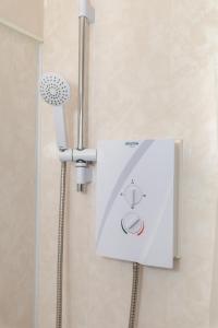 a shower with a shower head in a bathroom at No 1 Thornhill House in Hartlepool