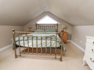Un pat sau paturi într-o cameră la Hillside House