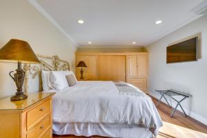 a bedroom with a bed and a lamp on a dresser at Serene Napa Retreat with Pool Access and Patio! in Napa +22 photos