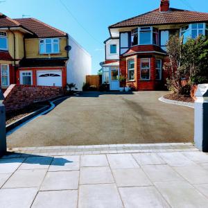 a large driveway in front of a house at Beautiful self-contained annex/Cottage in Hoylake
