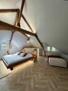 a bedroom with two beds in a attic at Luxueuse maison Hypercentre Dieppe in Dieppe