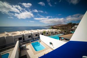 a view of a resort with a swimming pool at Jasmin in Puerto Calero