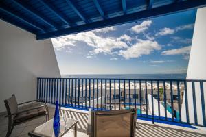 a balcony with a view of the ocean at Jasmin in Puerto Calero