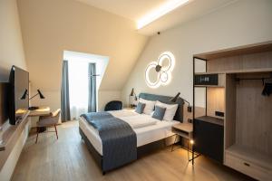 Postel nebo postele na pokoji v ubytování Hotel Böhlerstern