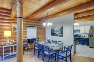 a kitchen and dining room with a table and chairs at The InnLet - Comfy Cabin By Conkling Marina in Worley