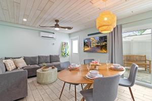 a living room with a table and a couch at Sea Foam - 173 in Siesta Key