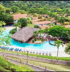 an aerial view of a resort with a swimming pool at VistaMar - La Morada del Ocaso in Playa Hermosa