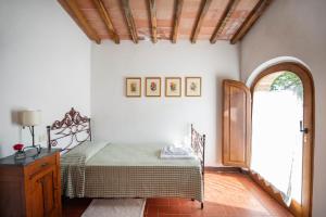 A bed or beds in a room at Colombina Még 13 kép