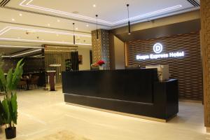 a lobby of a hotel with a reception desk at Duqm Express Hotel in Duqm