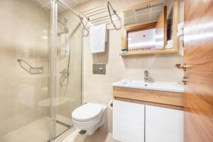 a bathroom with a shower and a toilet and a sink at Emin Palace in Istanbul