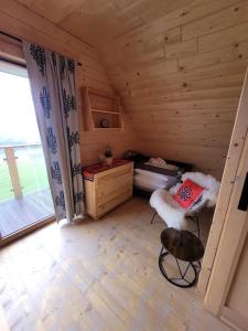 a room with a bed and a desk in a cabin at Osada pod Giewontem 3 - KACPROWY in Czerwienne