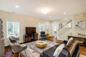 a living room with a couch and a tv at Luxury Mountain Home - by Ridgecrest and Asheville! in Black Mountain