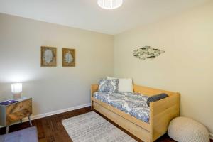 a small bedroom with a bed and a table at Luxury Mountain Home - by Ridgecrest and Asheville! in Black Mountain