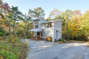 a house in the woods with a driveway at Luxury Mountain Home - by Ridgecrest and Asheville! in Black Mountain