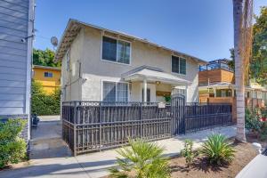 a house with an iron fence in front of it at Downtown Home with Free Parking, Less Than 1 Mi to Beach! in Long Beach