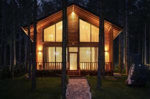 a cabin in the middle of a forest at night at Harmony Green Village Resort in Mahmudiye +40 photos