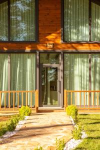a front door of a house with a porch at Harmony Green Village Resort in Mahmudiye