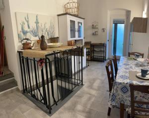 a kitchen with an island in the middle of a room at Trebiano a casa dei nonni in Arcola