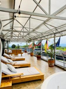 a room with several beds on the roof of a building at Hotel West California in Armenia