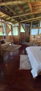 Postel nebo postele na pokoji v ubytování Ecohotel Soplo del Tambo