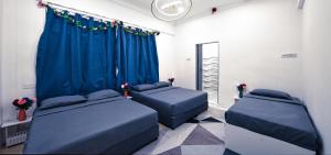 Ένα ή περισσότερα κρεβάτια σε δωμάτιο στο Penang Dream Banglo Sleeps 18 +24 φωτογραφίες