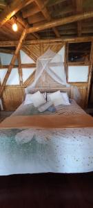 Postel nebo postele na pokoji v ubytování Ecohotel Soplo del Tambo