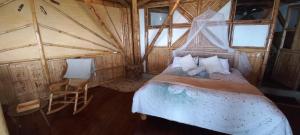 Postel nebo postele na pokoji v ubytování Ecohotel Soplo del Tambo