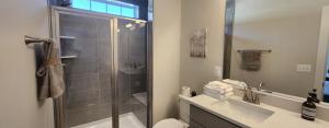 a bathroom with a shower and a toilet and a sink at Luxury in Fredericksburg in Fredericksburg
