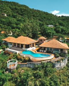 an aerial view of a resort with two swimming pools at La Haut Resort in Soufrière