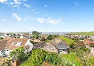 an aerial view of a houses in a suburb at Curlews Trevone in Padstow