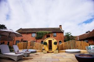 a backyard with a wooden fence and a house at Seckford Hall Hotel & Spa in Woodbridge