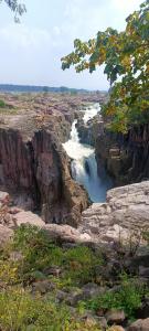 a view of a river in a rocky canyon at Namaste Homestay in Khajurāho