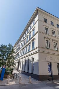 a large white building on the side of a street at K40 Boutique Apartment in the City Center in Budapest
