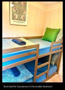 a bunk bed for two person in the smaller bedroom at Wellness bungalow with jacuzzi &sauna&private garden near Amsterdam in Vijfhuizen