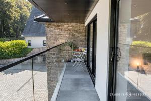 an external view of a house with a glass door at Townhouse near BEACH, Sleeps 8, Garden & Parking - Carbery Lux in Bournemouth