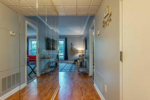 a hallway of a home with a living room at Famous MUSIC ROW 1 Bedroom Condo with FREE Parking and Pool in Nashville