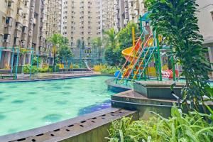 a water park with a playground in a city at OYO Life 93120 Apartement Gateway Cicadas By Sarana Cipta Mahakarya in Bandung