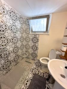 a bathroom with a toilet and a sink at Varosha View House 