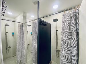 a shower with a glass door in a bathroom at Friends Oasis in Aqaba +18 photos