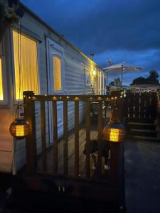 a train car with two lights on a railing at Lake District Caravan in Cockermouth