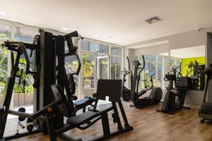 a gym with a bunch of tread machines in a room at Elegant Flat Paulista Alameda Campinas Garagem , Pool, Ar Cod, in Sao Paulo